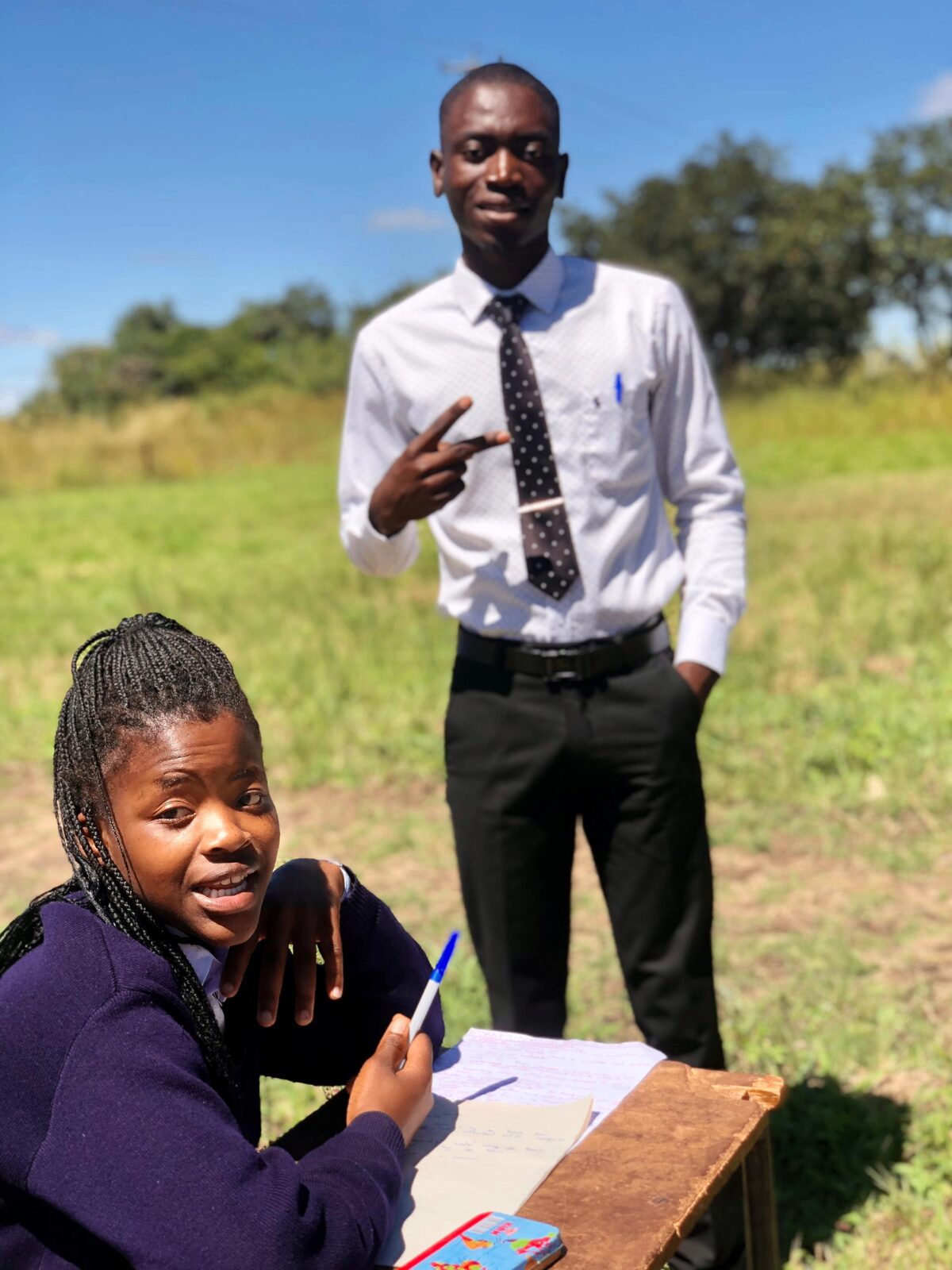 Ronald teaching a student outdoors