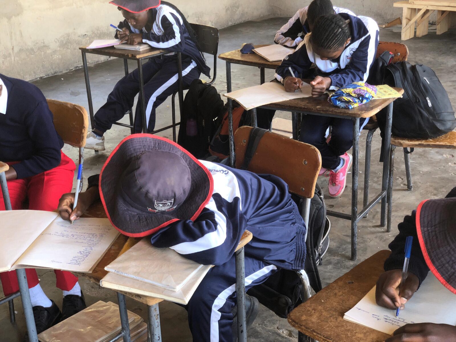 Students writing in a Zimbabwean classroom