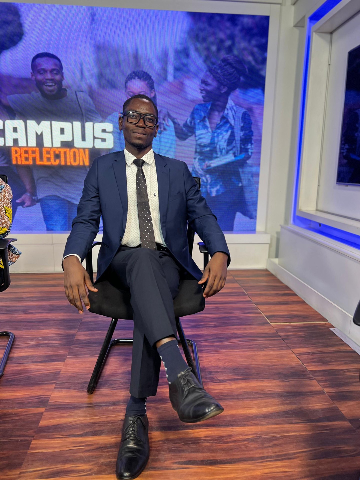 Ronald seated on the Campus Reflection set